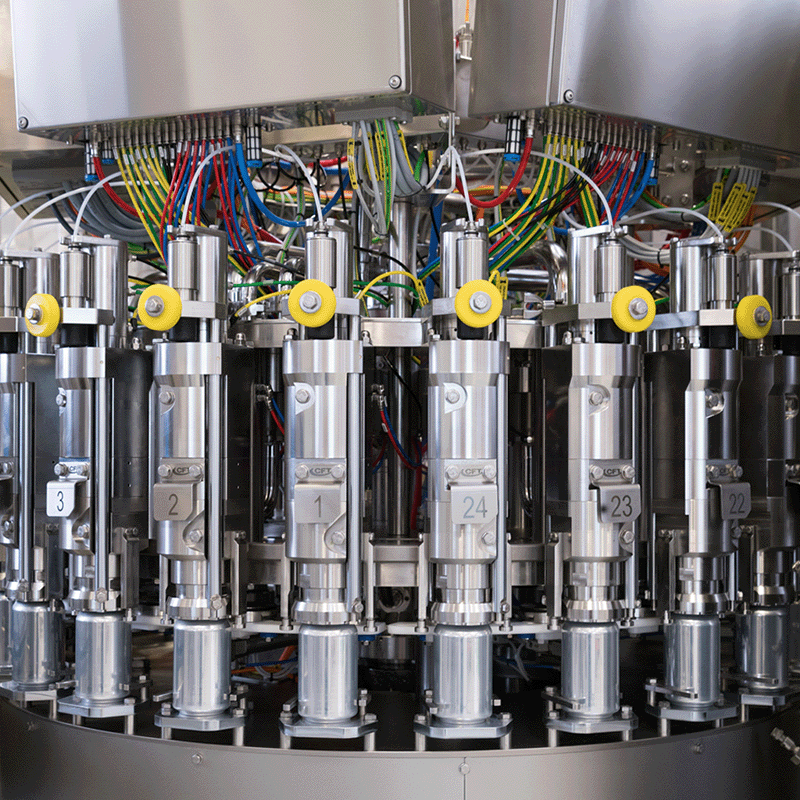 Rotary filling carousel with multiple synchronized heads ensuring continuous operation and high production efficiency.