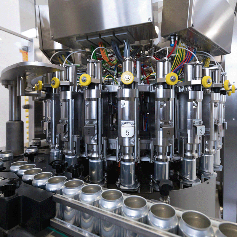 Rotary filling carousel with multiple valves ensuring smooth and continuous can movement during the filling process.