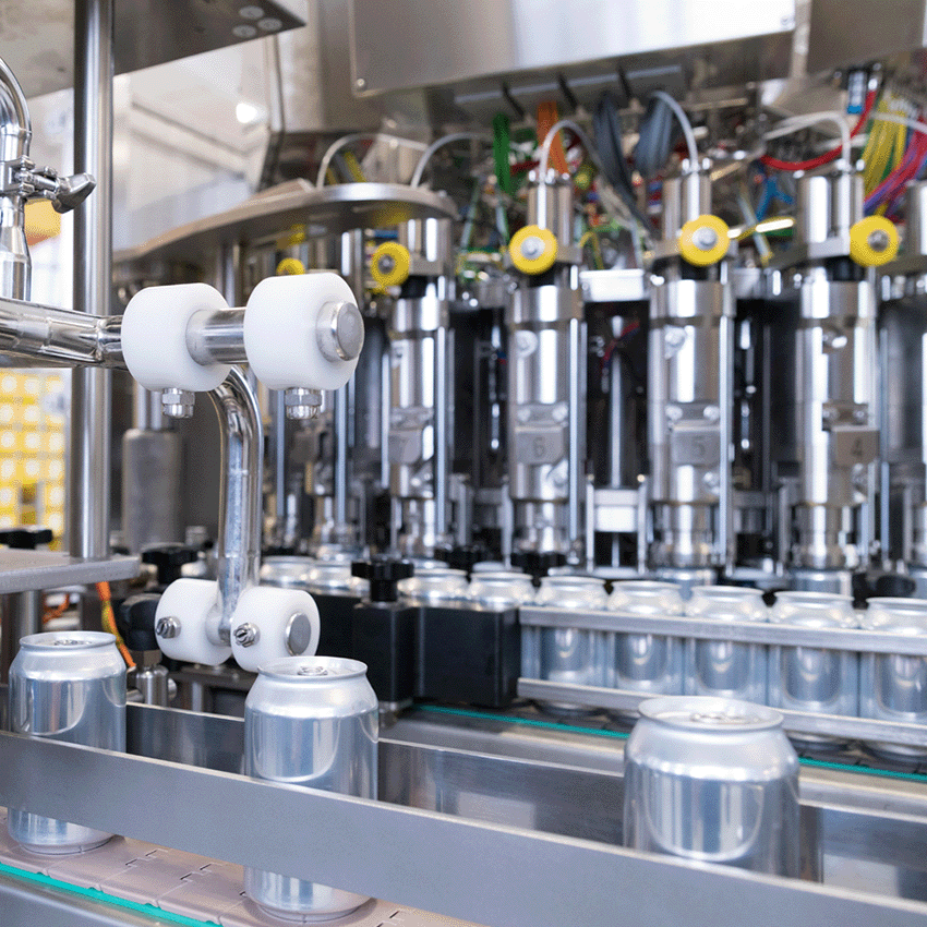 Automated rotary canning line with integrated conveyor and minimal manual intervention during can handling.